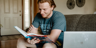 A man reading from a textbook
