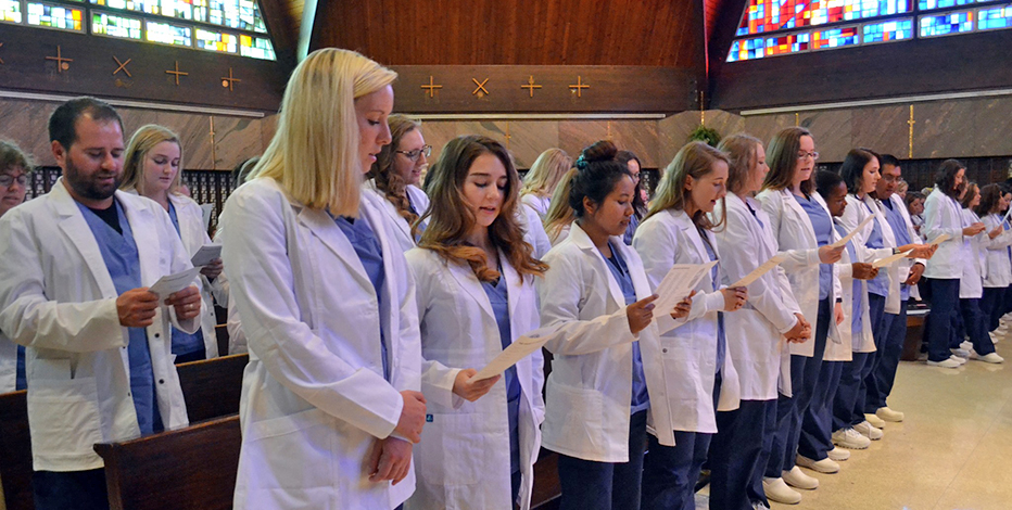 Students in their white coats during the white coat ceremony