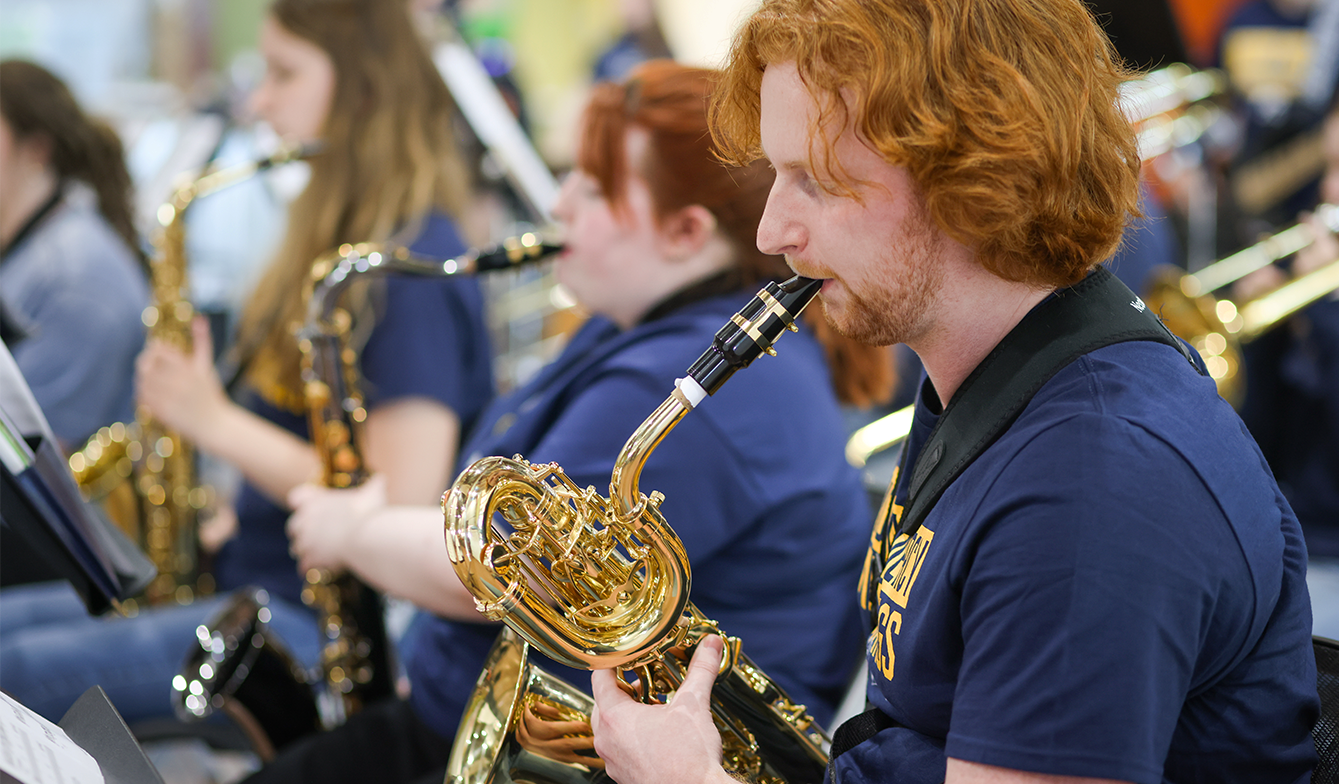 Student playing an instrument.