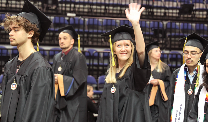 students walking commencement