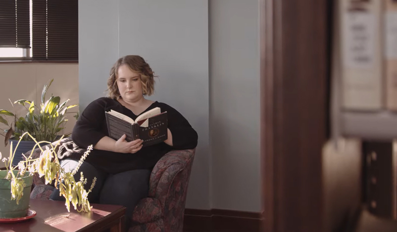 Dani Dunphy reading a book